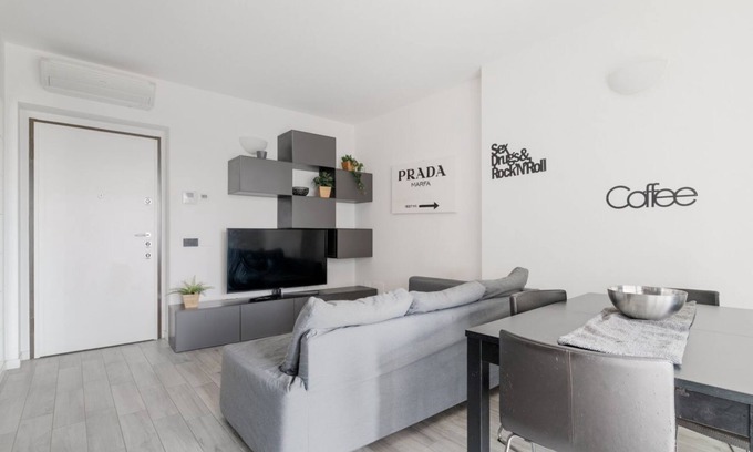 Gallaratese Apartment | Cozy 50m2 apartment with balcony, located on the seventh floor of a building with a lift, in a residential context surrounded by greenery.The area is very quiet and well connected thanks to local public transport: a 10-minute walk away is the M1 Rossa "B