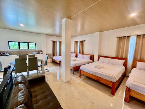 Catangnan House | Cozy Family Studio - Ronaldos Inn Twinex Suite