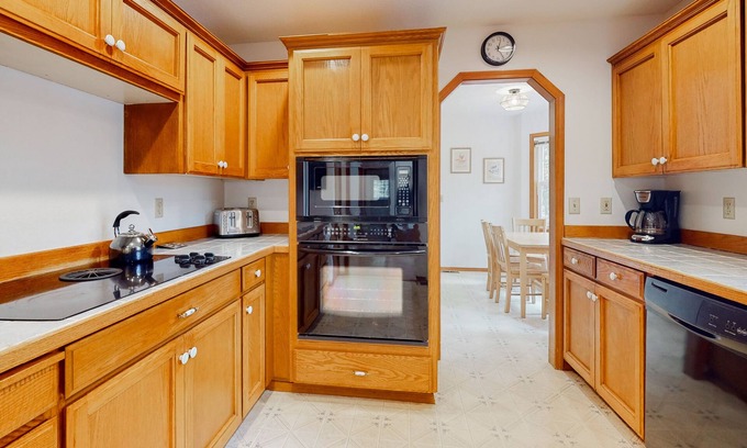Zigzag House | Cozy home with river access, private hot tub, wood stove, fireplace, & W/D