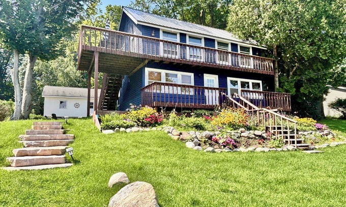 Rapid City House | Cozy Main Level Torch Lake Stay with Private Entry & Fire Pit