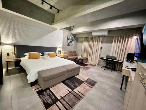 Kaunlaran Apartment | Cozy Spacious Hotel Type Condo with PS5 Smart TV and WiFi