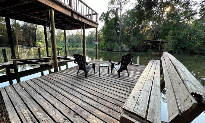 Fairhope Cottage | Cozy waterfront camp with dock and boat slip. Multiple outdoor spaces to enjoy!