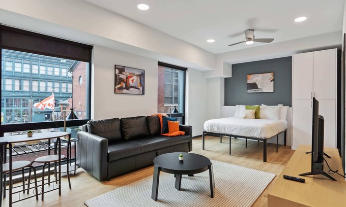 Lockerbie Square Apartment | CozySuites Mass with parking, lounge and roof deck 12