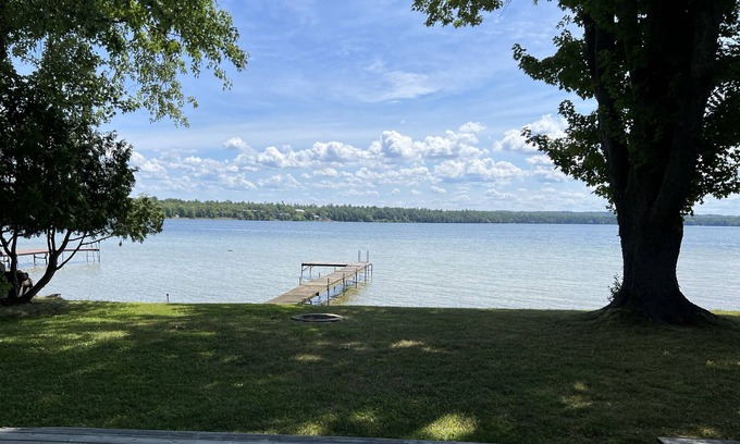 Interlochen Cottage | Delightful sunny beachfront cottage with fire pit 4 min to Concerts!