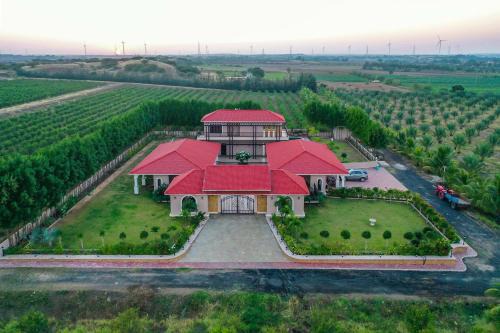 Anjar Villa | Desert Palms by StayVista in Kutch, nestled in orchards, features a swimming pool and a scenic balcony for a serene getaway