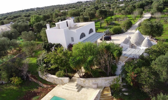 Carovigno Villa | Dionisia trulli with swimming pool, private trullo and sea view among olive tree
