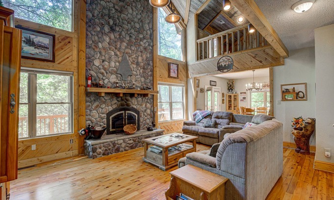 Wiley Cabin | Dog-friendly riverfront cabin with waterfall view, large decks, firepit, Ping-Pong