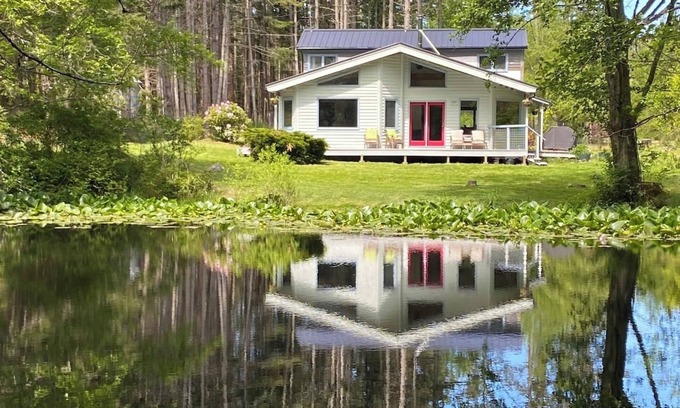 Eastsound House | Dragonfly Pond house is a rustic, spacious, light-filled vacation rental home on Orcas Island with high ceilings overlooking a tranquil pond. Clean & comfy. Located in 7 acres of forest, it's peaceful and secluded. Close to town and the ferry.