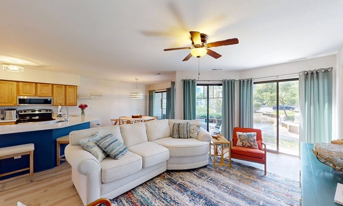 Fenwick Island Condo | East of Sun condo with water-view patio, on-site pool & tennis - near beach