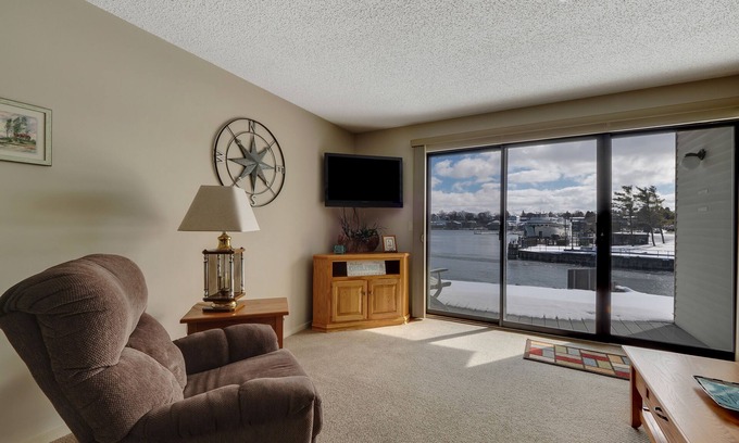 Charlevoix Condo | Edgewater Inn 115 | Sunrise Over Lake Charlevoix | Pool, Hot Tub, Sauna