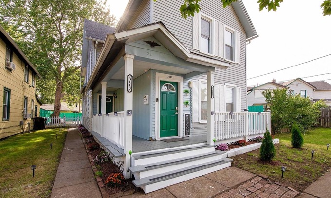 Tremont House | Emerald Oasis: Tremont 4BR Duplex by Christmas Story House | Patio, Laundry, Parking 7 Min Downtown