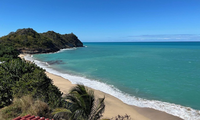 St. John's House | Enjoy breathtaking ocean views from a private patio, steps away from the beach.