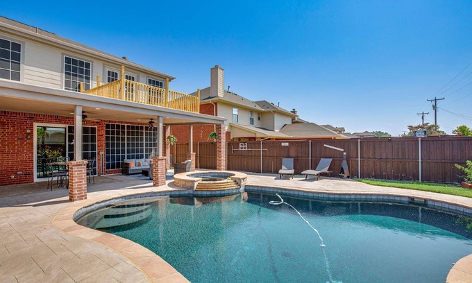 Rowlett House | Enjoy the peace and quiet back patio with Lagoon pool.