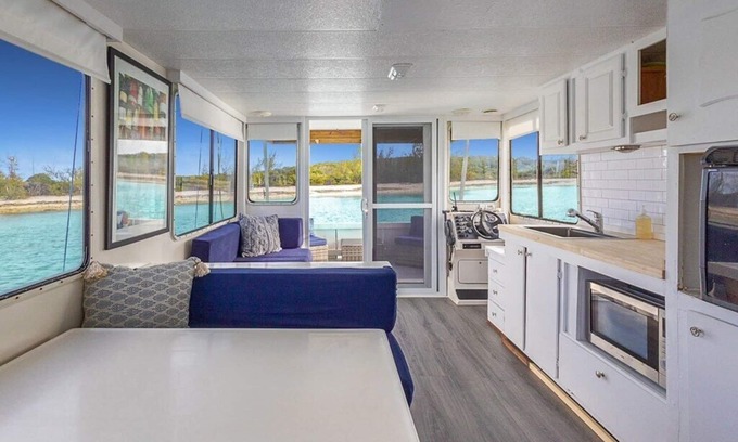 Stocking Island Boat Rental | Escape to Pineapple! Enchanting 1-bedroom house boat in George Town.