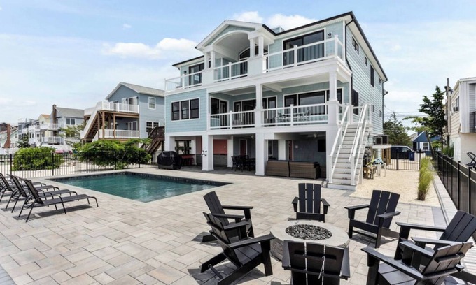 Ship Bottom House | Expansive Bayfront Home w/Heated Saltwater Pool & Dock
