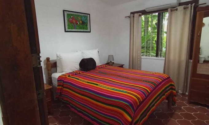 San Ignacio Apartment | Experience comfort and relaxation in our air-conditioned apartment, featuring two spacious bedrooms, a welcoming living room, a fully equipped private kitchen, and a well-appointed private bathroom. Perfect for families or groups.