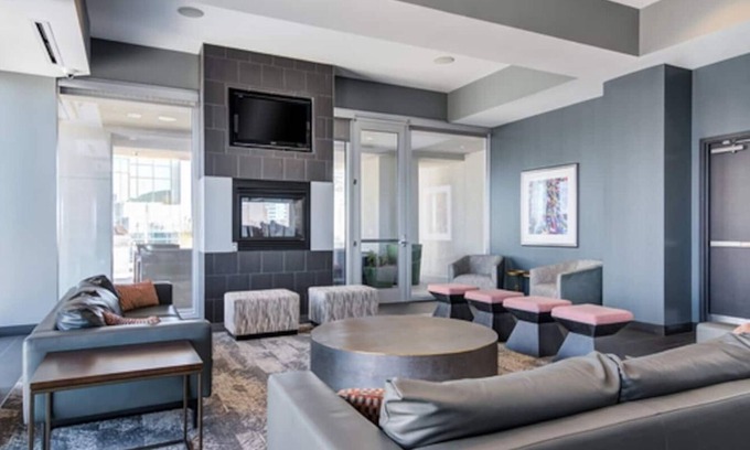 Midtown Apartment | Experience luxury at Royal Escape Midtown, perfectly located for relaxation and adventure. Minutes from top attractions, dining, and corporations, this stylish retreat offers access to a resort-style rooftop pool.
