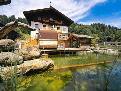 Bramberg am Wildkogel House | Farmhouse in Bramberg with Natural Pond