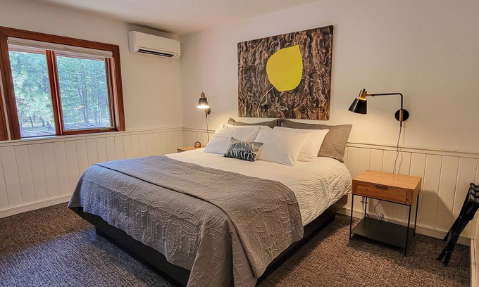 Mazama House | Fir - king bedroom with couch at The Inn At Mazama