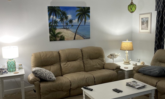 Calabash Condo | First floor corner unit overlooking 11th fairway on premier golf course.