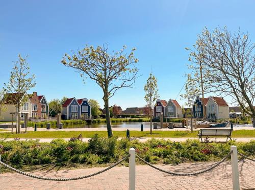 Neuharlingersiel Apartment | Fischerhäuschen am Kurpark-See ohne Schwimmbad- und Saunanutzung