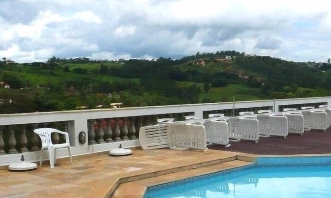 Serra Negra Apartment | Flat in green area with hotel service - 1 suite