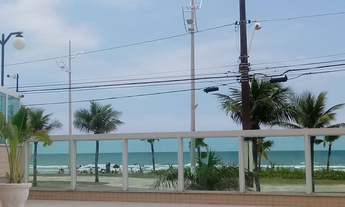 Caicara Apartment | Foot in the sand at Praia Grande