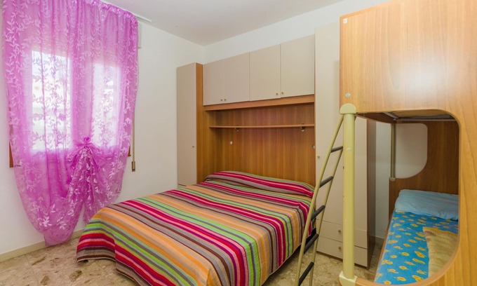 Bibione Pineda Apartment | Gabbiano tree-room flat surrounded by the green of the quite pine forest