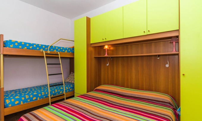 Bibione Pineda Apartment | Gabbiano tree-room flat surrounded by the green of the quite pine forest