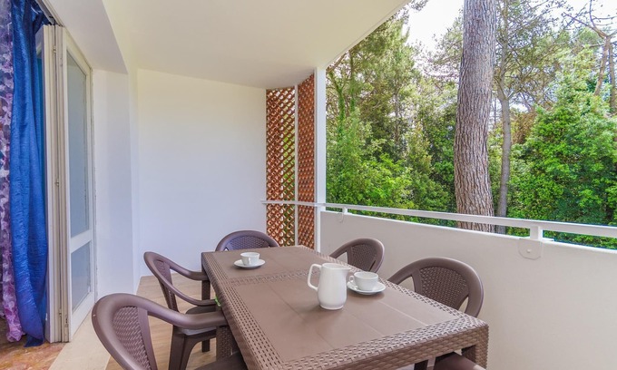 Bibione Pineda Apartment | Gabbiano tree-room flat surrounded by the green of the quite pine forest
