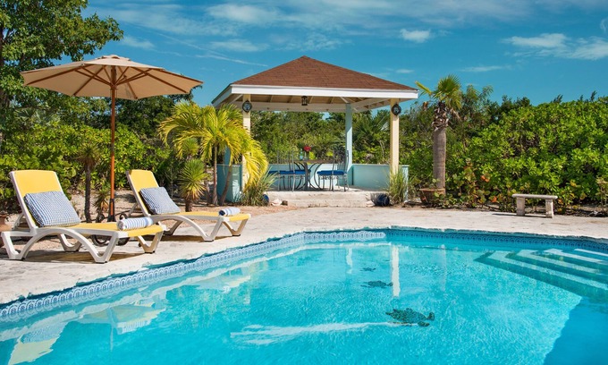 Leeward Settlement Cottage | Gorgeous Pool, Private Garden, 5 min walk to Pelican Beach on Grace Bay.