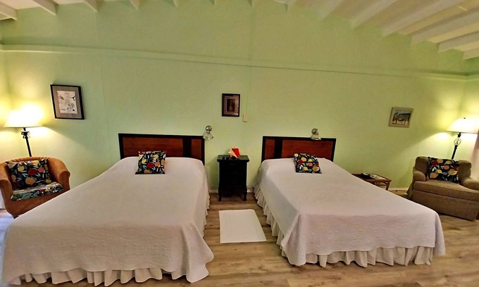 Cockburn Town House | Grand Turk Vibes - Balcony double queen room with partial ocean view!