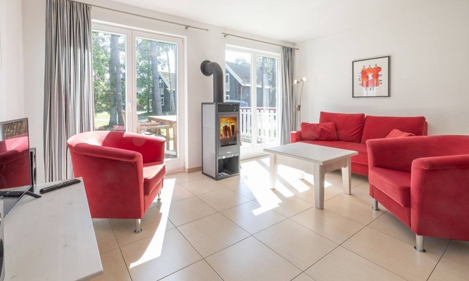 Glowe House | Great vacation home with south-facing terrace, sauna, whirlpool bath, wood-burning stove & parking space