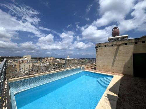 Nadur House | Historic Farmhouse close to San Blass Beach with Courtyard, Kitchen Terrace and Rooftop Pool
