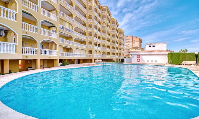 Xeraco Beach Apartment | Holiday Apartment 'Barlovento I' with Sea View, Terrace, Shared Pool & Wi-Fi