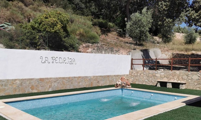 Villanueva de Algaidas House | Holiday Home 'Casa La Pedriza Para 8' with Mountain View, Shared Pool and Wi-Fi