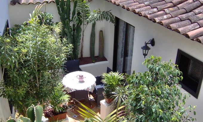 El Guincho Apartment | Holiday flat "Apartamentos Monasterio de San Antonio No. 1" with partial sea view and terrace