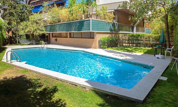 Nueva Espana Apartment | Homerez - Nice studio for 2 ppl. with shared pool, garden and terrace at Madrid