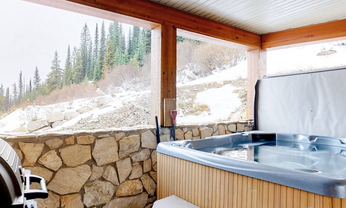 Big White Ski Resort Condo | Homey ski-in/out condo with private hot tub & entertainment