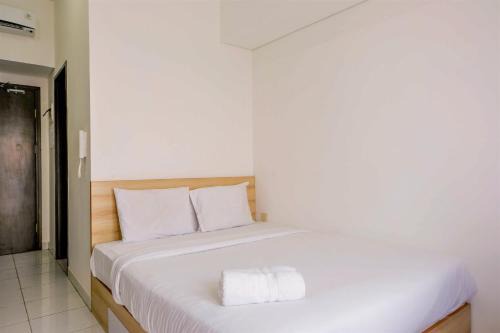 Pagedangan Apartment | Homey Studio at Casa De Parco Apartment By Travelio