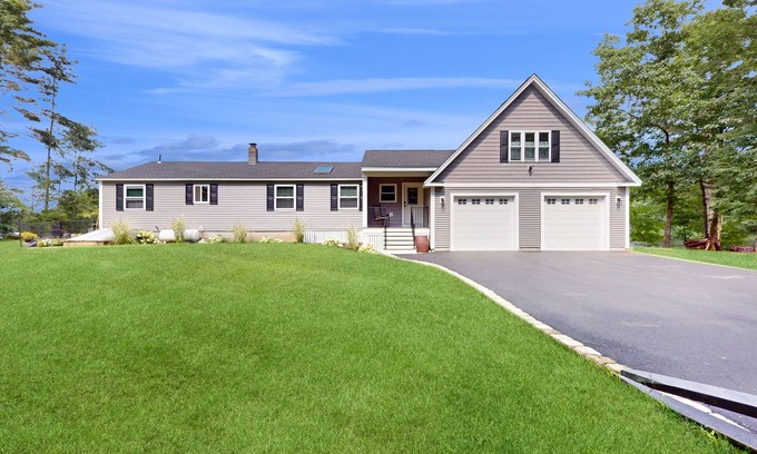 Manchester House | Idyllic & sunny lakefront home with large patio & views - near golf & skiing