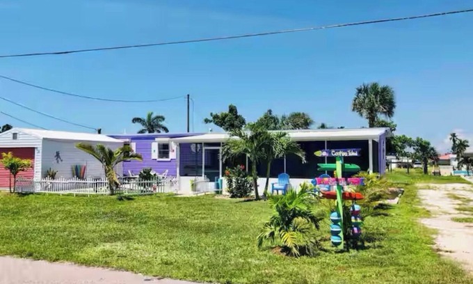 Flamingo Bay House | ISLAND TIME! DOCK! POOL! KAYAKS! BOAT To BEACH! PETS ALLOWED! The Purple House