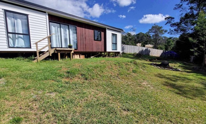 Mangonui House | Itzy Bitzy house is colourful, cosy, fully fenced with sea views