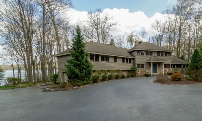 Blakeslee House | Johnny Appleseed- Lakefront Home with Private Dock and Community Pool