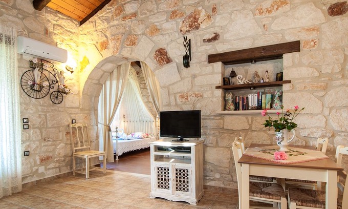 Psarou Villa | Kavos Psarou stone and wooden built sea front sea view traditional/lux villa