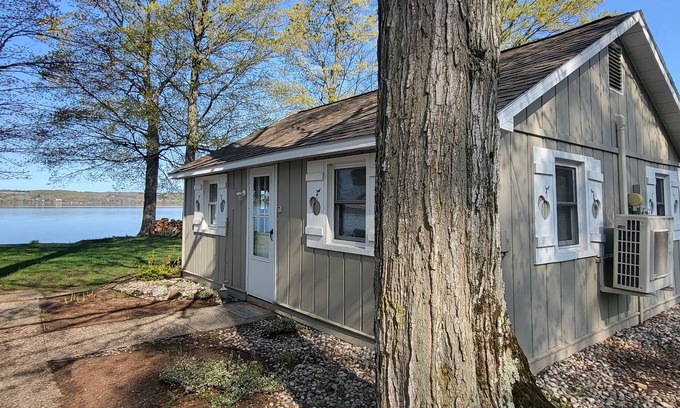 Traverse City Cottage | Lake Leelanau Waterfront Cottage with Mini Harbor - Close to Traverse City!