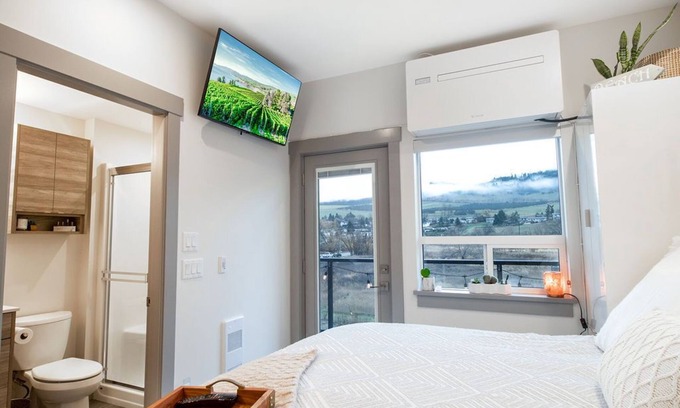 Vernon Apartment | Lake Okanagan beach condo w/private buoy, AC, heated outdoor pool, patio, SUPs