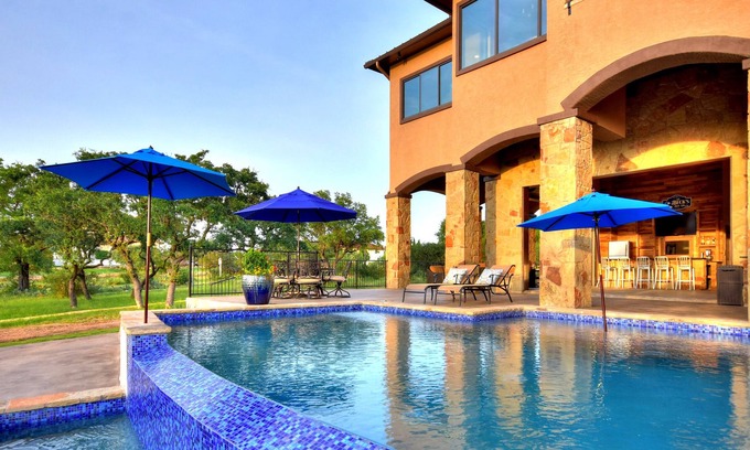 Highland Lake Estates Villa | Lake Travis Waterfront Home w/ views, Pool, Dock, Outdoor Kitchen, Open-Air Bar