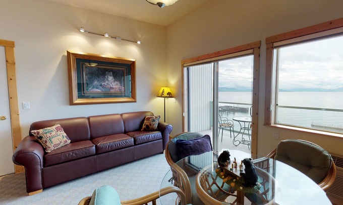 Polson Apartment | Lakefront condo with water-view balcony, central AC & swimming dock