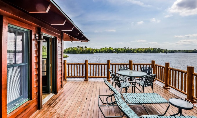 Manitowish Waters Condo | Lakefront home with large deck, gas grill, wood fireplace, heated pool, firepit
